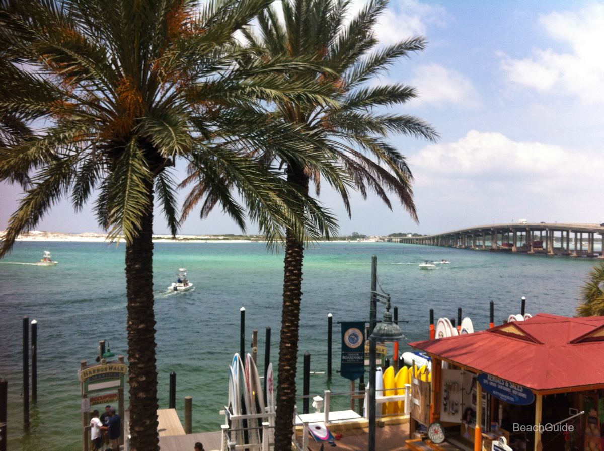 View of Destin bridge from Harborwalk Village, where many fishing and cuise boats depart. 