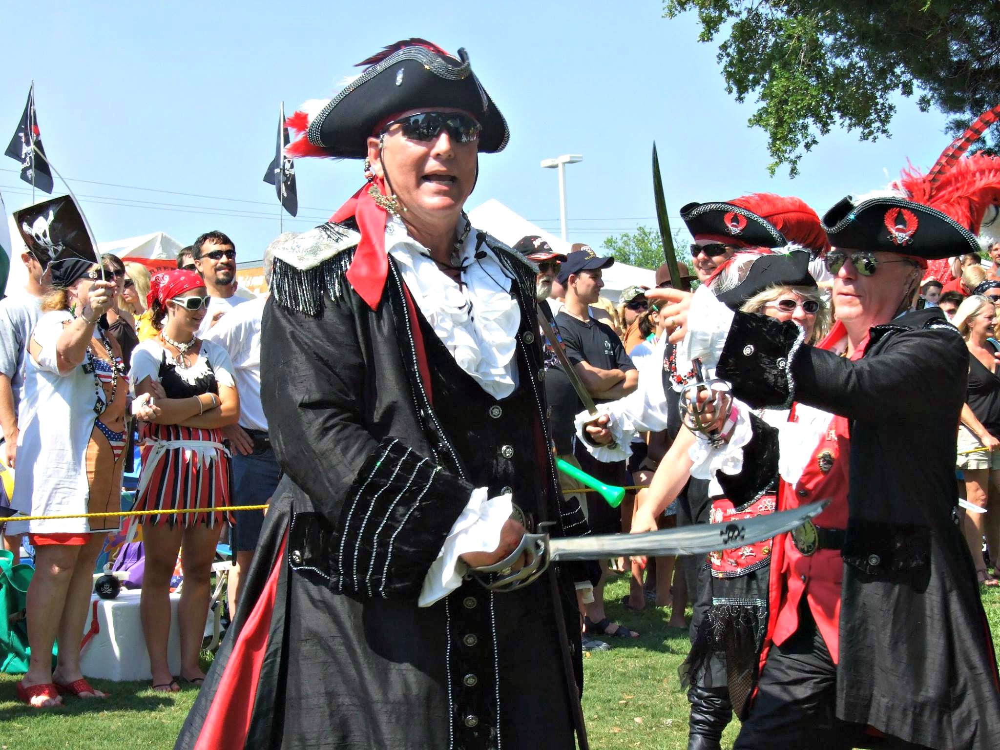 Two pirates skirmish with sword and knife in front of crowd at Billy Bowlegs Festival in Fort Walton