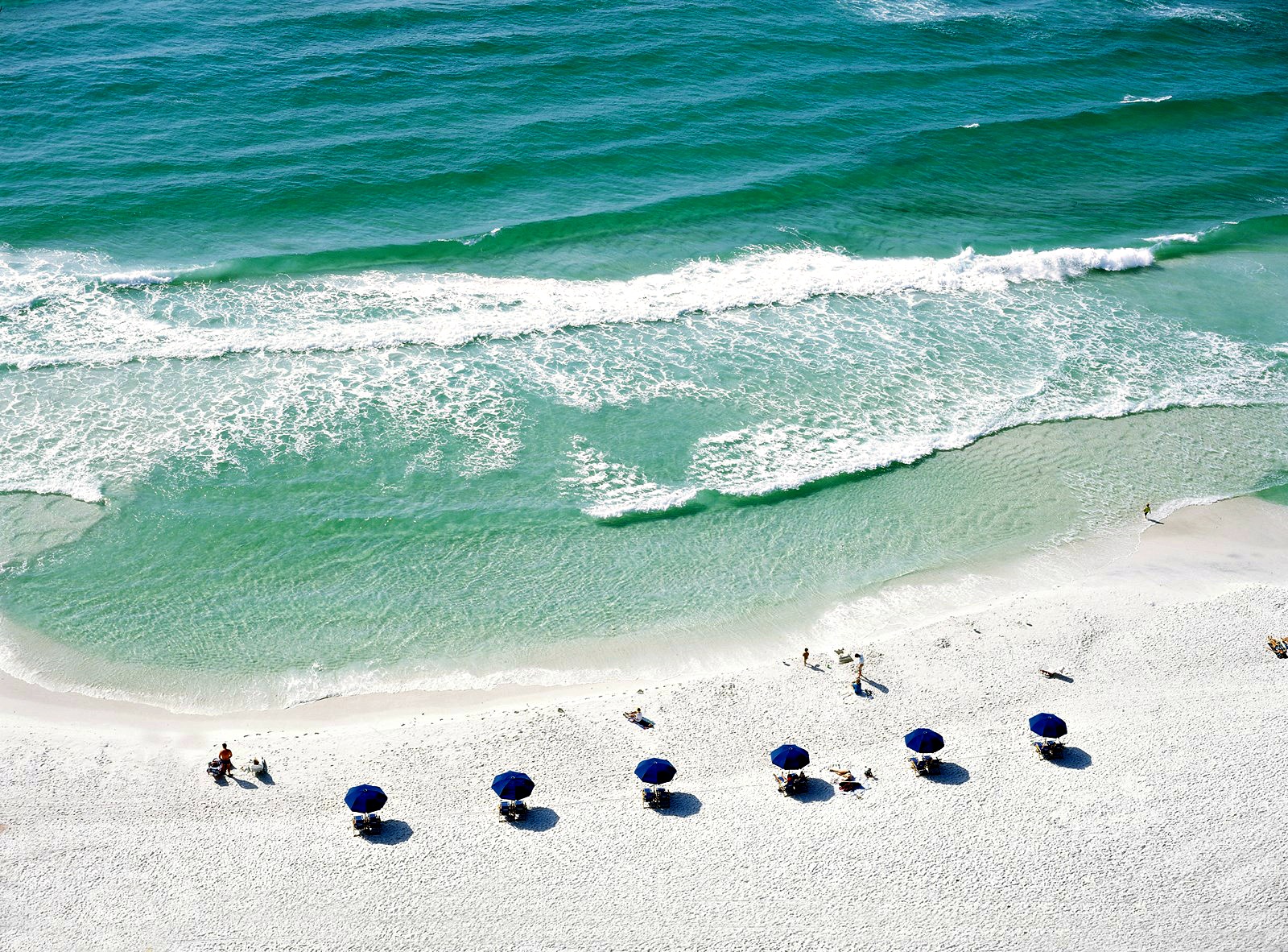 Gulf of Mexico and white-sand beach, plus blue beach umbrellas, at Sandestin Golf and Beach Resort