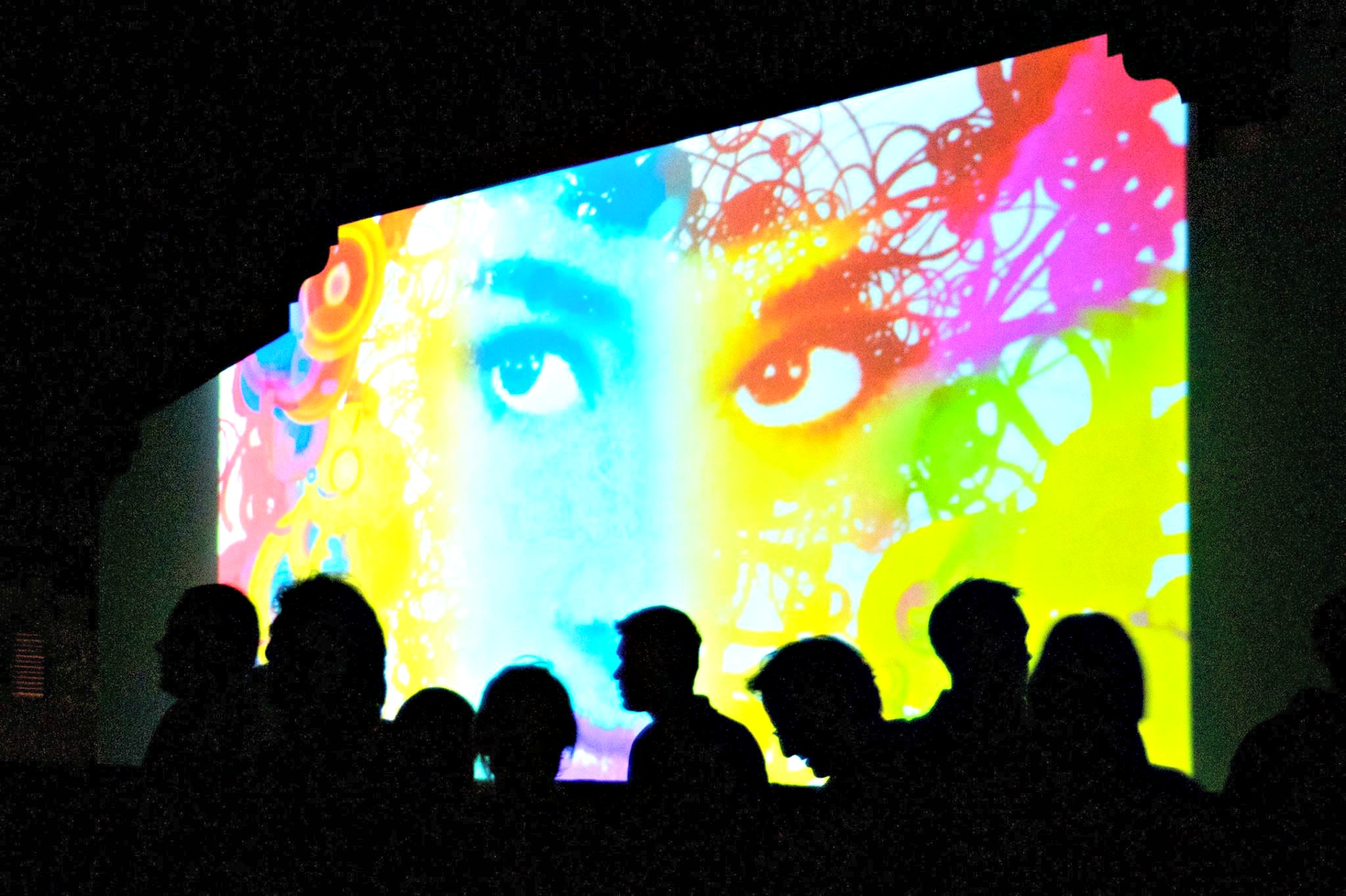 Digitally projected woman's face at Digital Graffiti in Alys Beach for Highway 30-A arts blog
