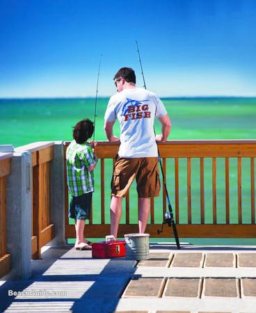 Father and son getting ready to fish from the pier in Panama City Beach