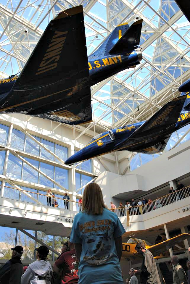 Blue Angels blue-and-yellow jets hang suspended from the ceiling at the National Naval Aviation Museum, one of ten easy day trips from Gulf Shores