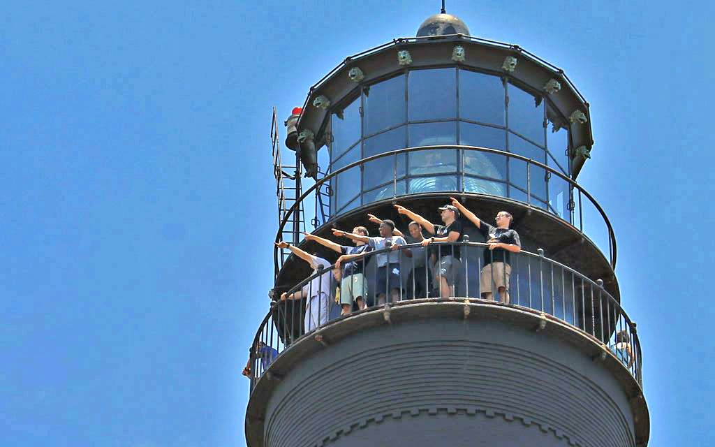 Visitors enjoy the view from the top of the Pensacola Lighthouse, one of ten easy day trips from Gulf Shores