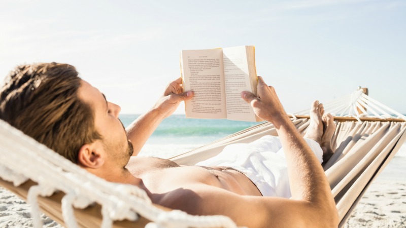 Reading in a hammock is a relaxing beach activity that requires little planning or money