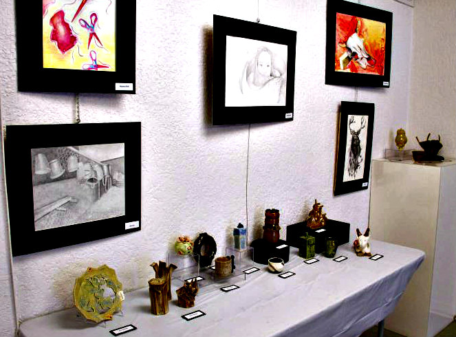 Anna Maria Art League tabletop and wall displays of paintings and pottery