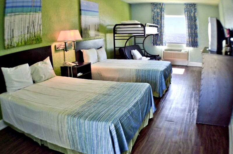 Room with bunk beds at Boardwalk Beach Resort Hotel in Panama City