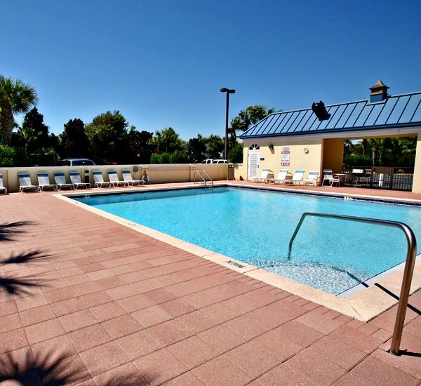 Spacious sundeck by the pool at the Leeward Key Condominiums  in Destin Florida