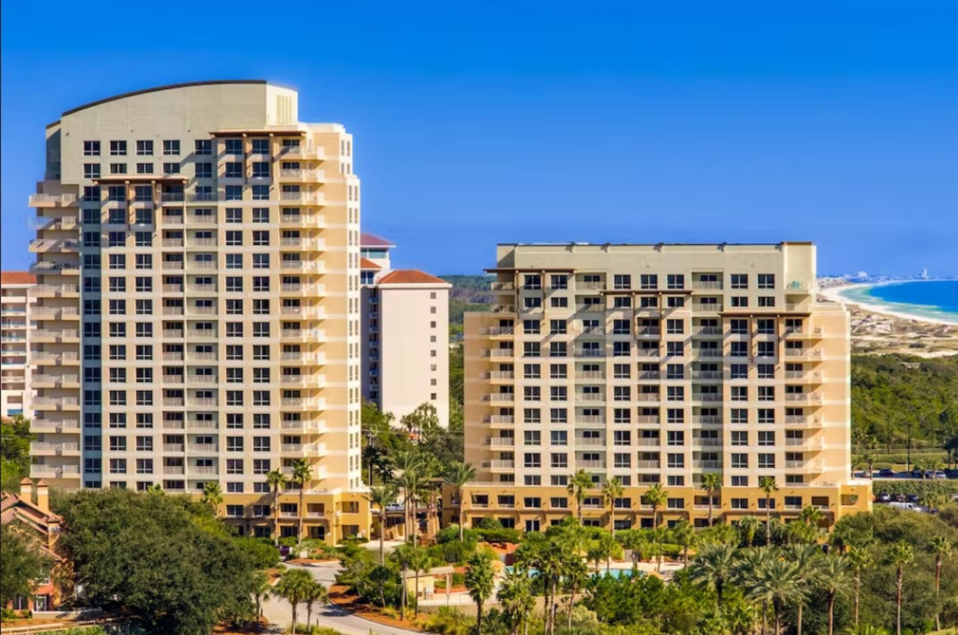 The Luau's condos feature balconies overlooking the resort pool and offering sweeping views of the Gulf beyond