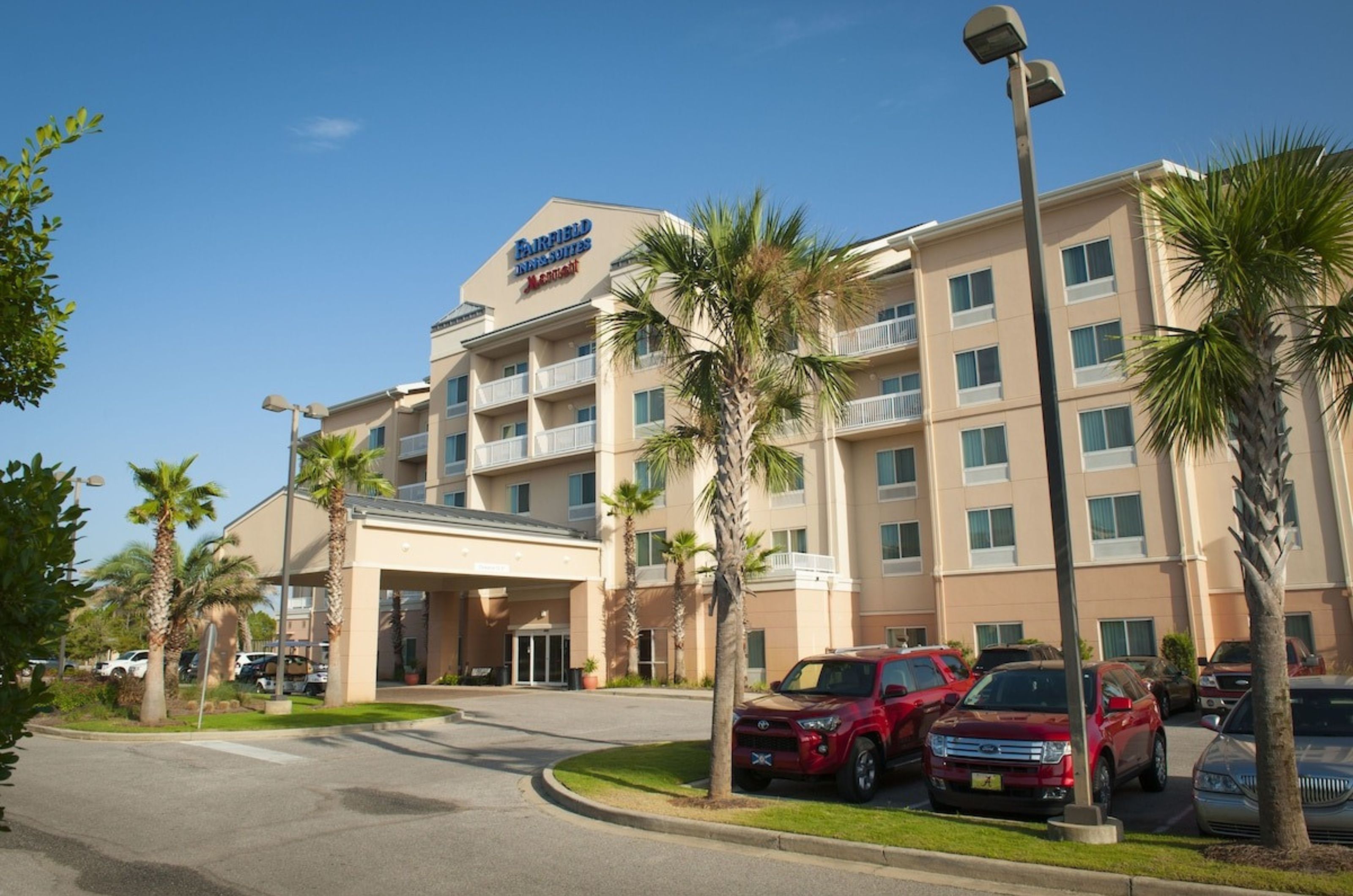 View of the parking lot and the entrance to Fairfield Inn and Suites in Orange Beach Alabama 