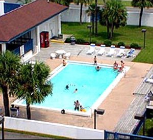 View from above of the pool and sundeck at Surf Dweller Fort Walton Beach