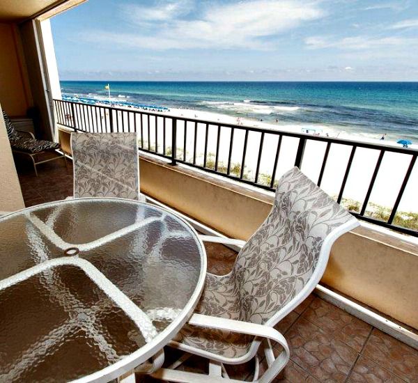 Table and chairs on a Gulf-front balcony at Surf Dweller Fort Walton Beach