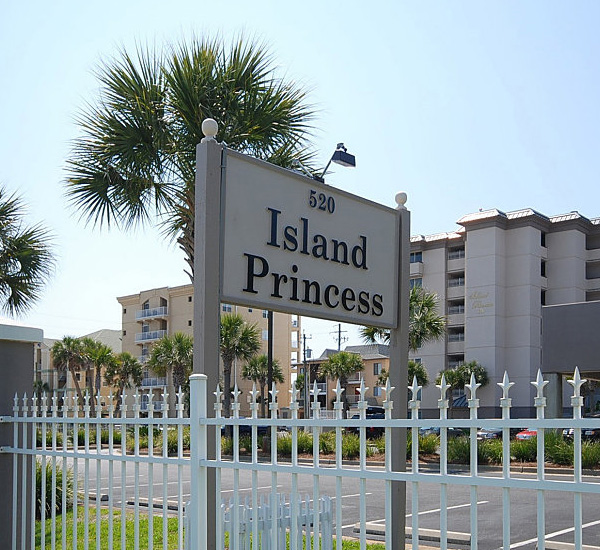 Street-side sign inside fenced grounds at Island Princess Fort Walton