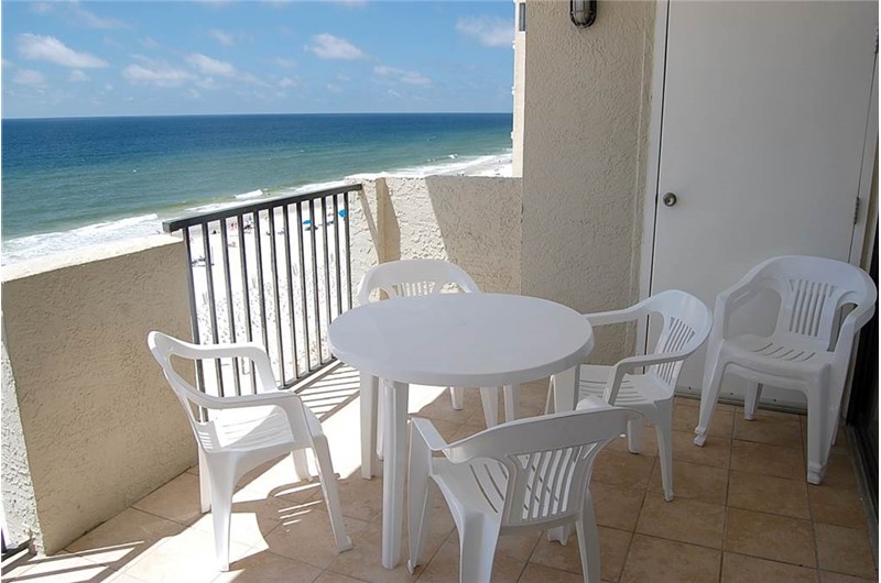 Relax on your beachfront balcony at Tropical Winds Gulf Shores AL.