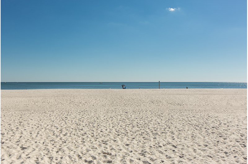 White sand beach in front of Phoenix VII in Orange Beach Alabama