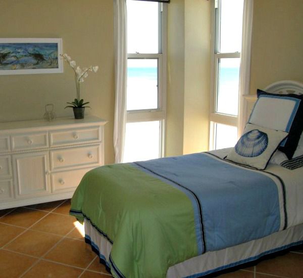 Full sized bed in unit at Sans Souci in Pensacola Beach.