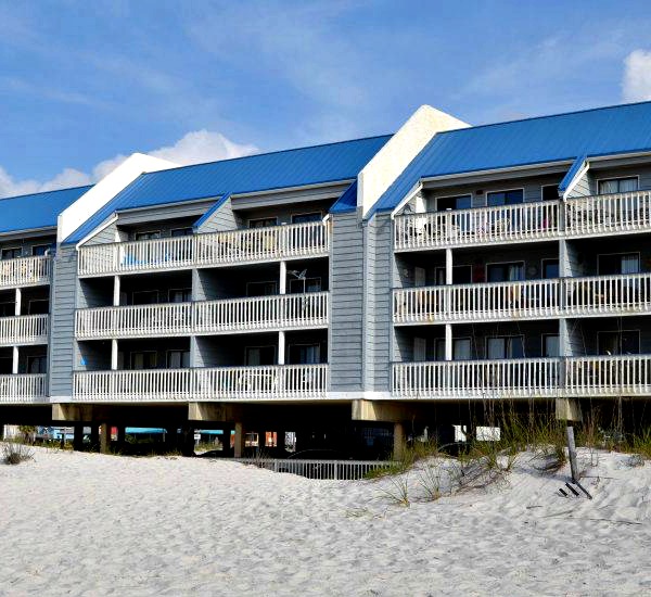 Beach view of exterior of Regatta Condominiums in Gulf Shores Alabama