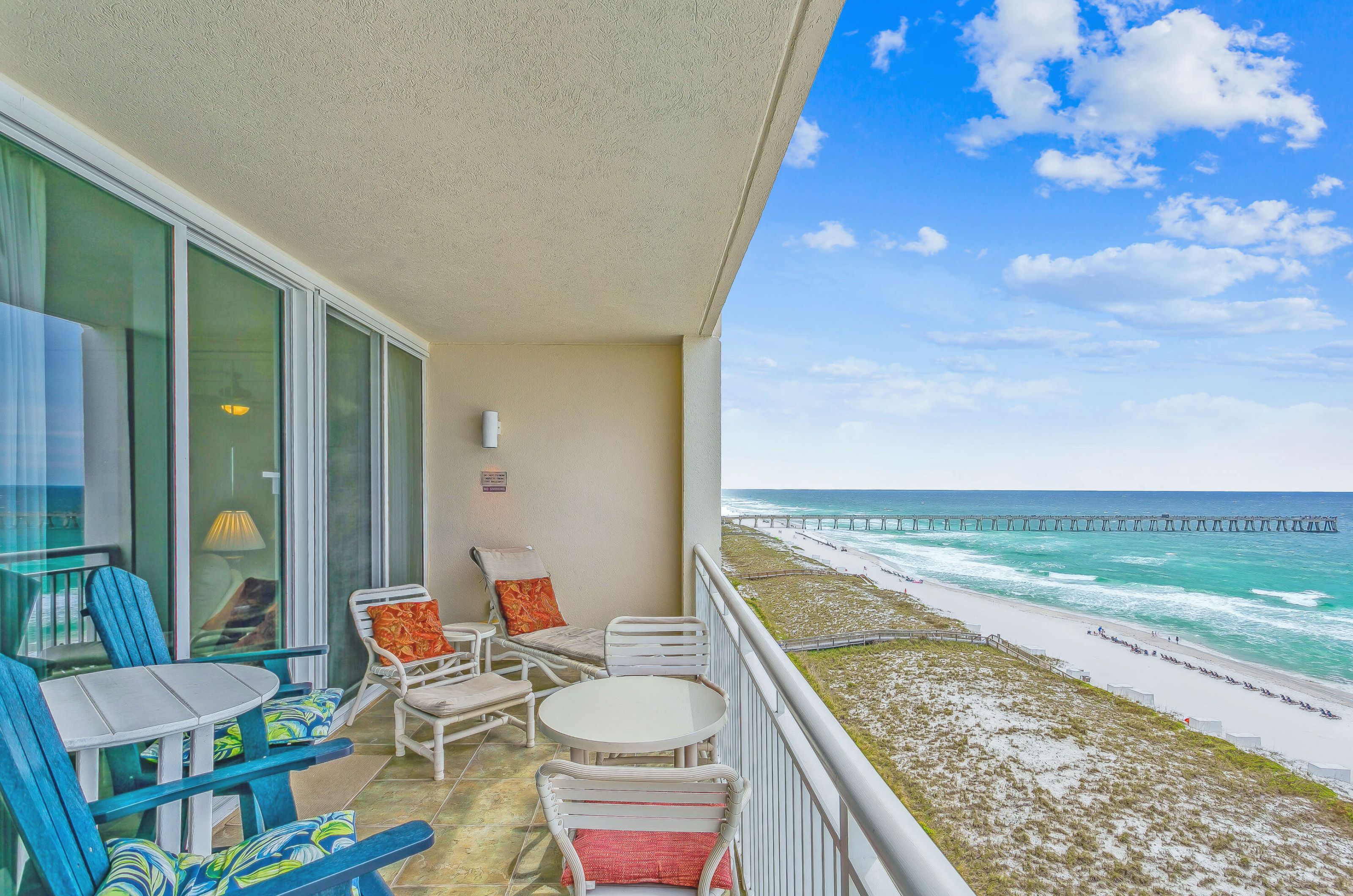 Private balcony with lounge chairs and tables over looking the Gulf of Mexico