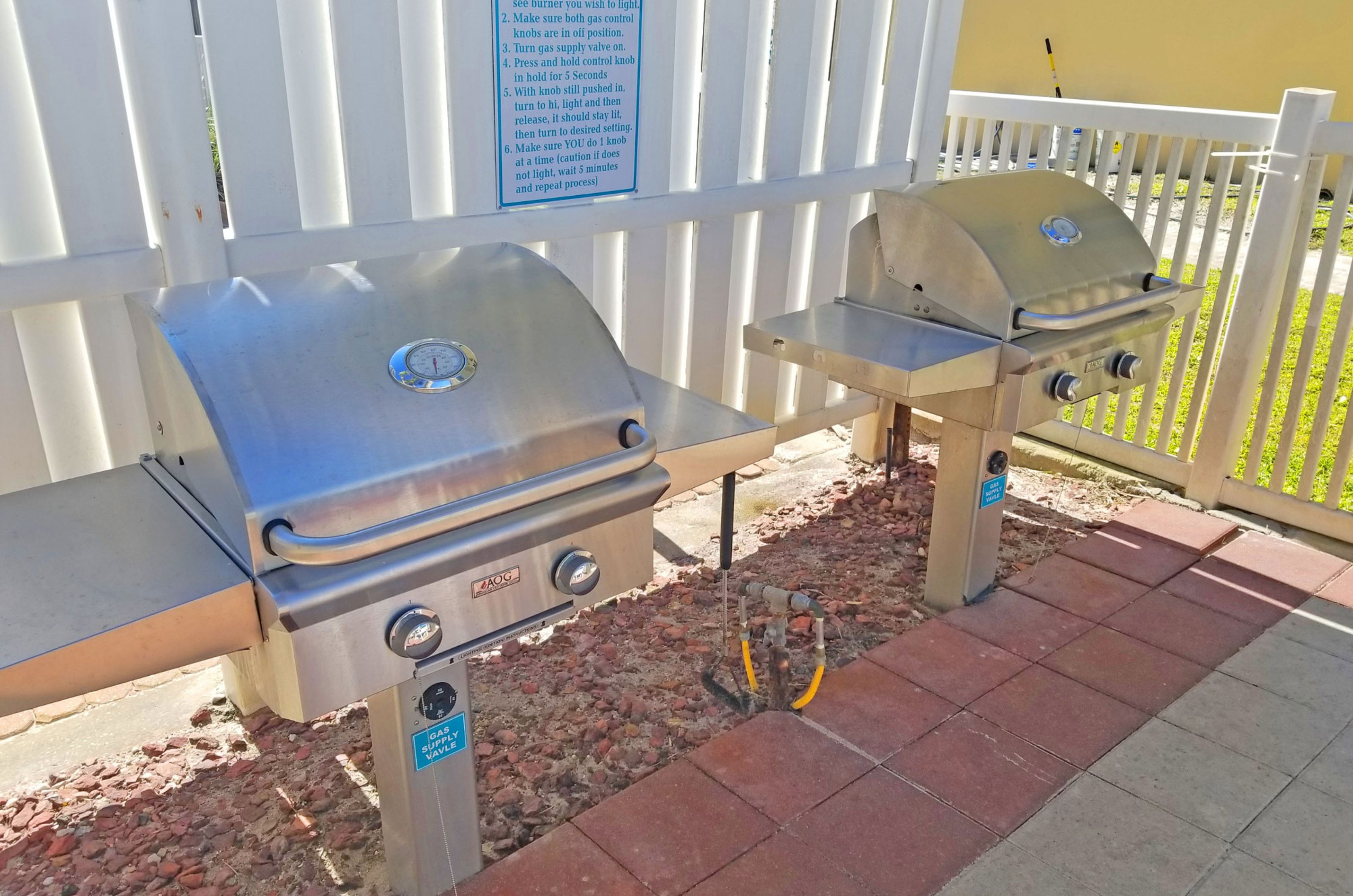 Community gas grills on an outdoor patio at the Pearl of Navarre 
